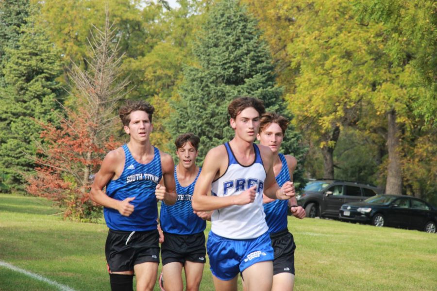 Quin Karas (far left) and John Fielder (far right) are pictured at a 2021 Cross Country season event