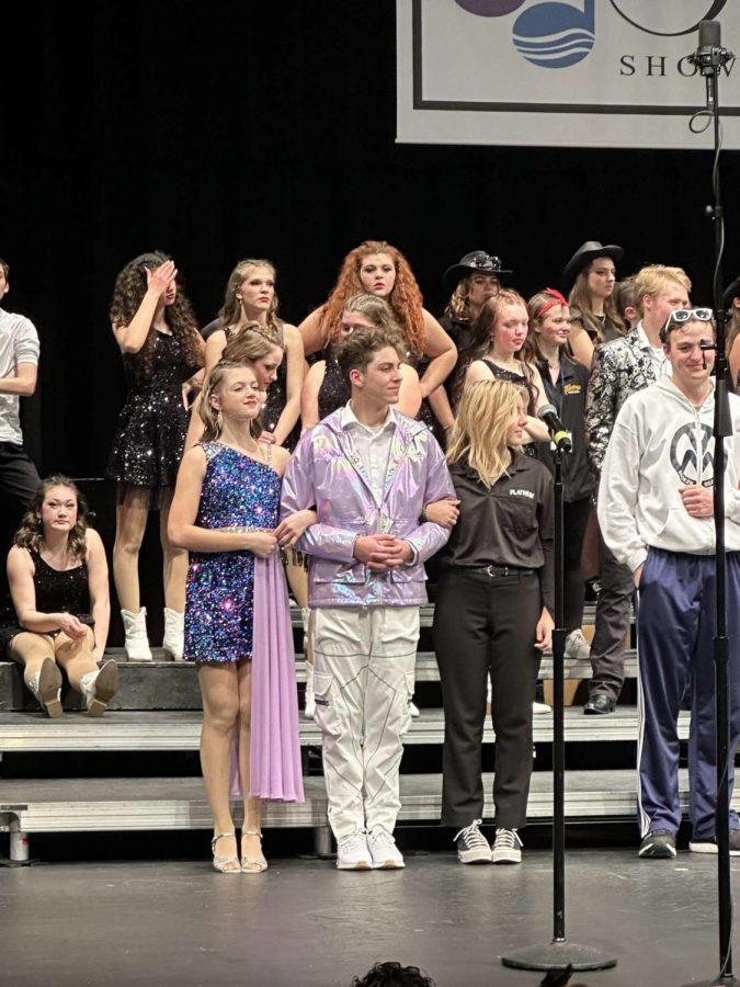 (left to right, all 12th): Natalie Allrich and Grayson Truax, both of Titanium, stand with Sarah Pinkerton from the Platinum show band at the awards presentation following finals.