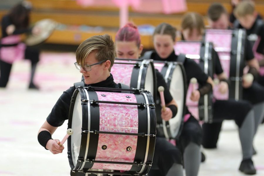 Kate Koske, 9th, and the rest of bass line prepare their opening movements to their show, Sakura. (Leo Lopez)