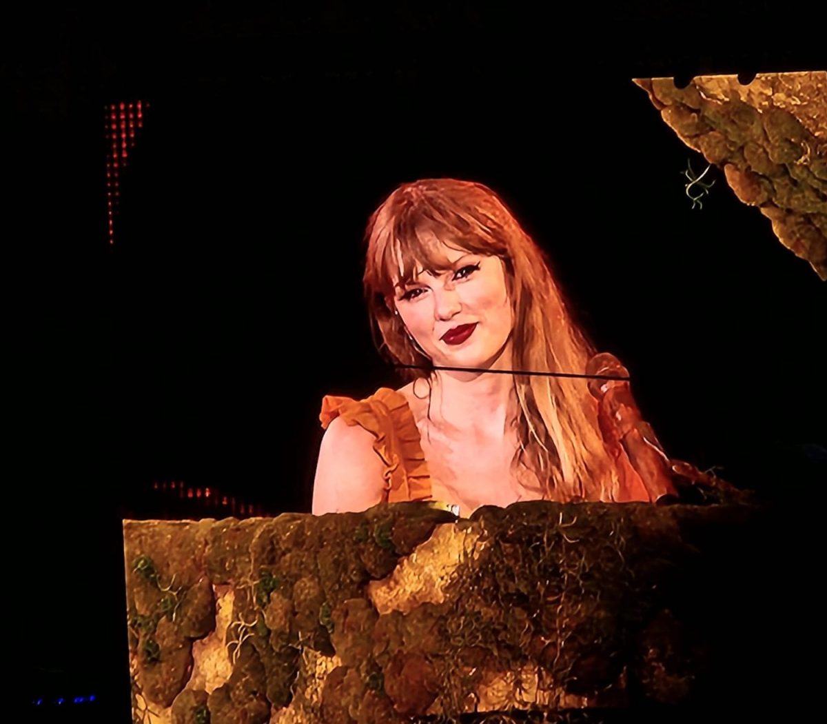 Taylor Swift performs a piano piece during the representing her Folklore era