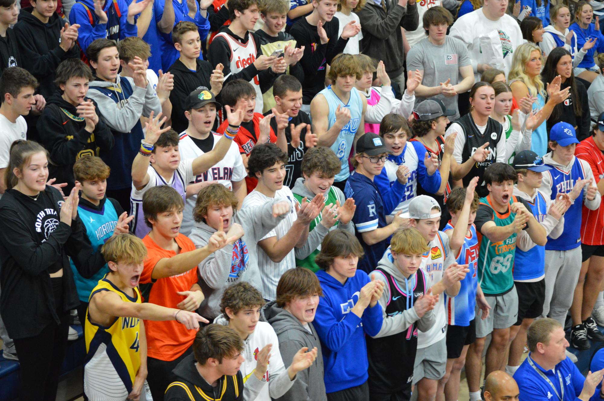 Black Hole members wear jerseys to correspond to the student section's theme for the A7 District Championships at Elkorn South.