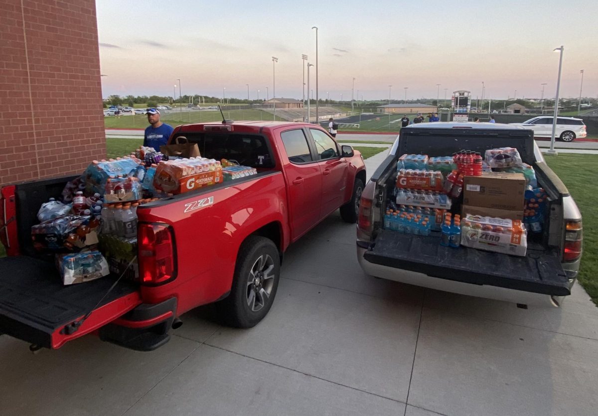 Two trucks overflowing with sports drinks donated during the scrimmage. 