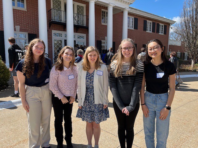 PLHS students Caroline Williams, Vicky Wu, Abby Reilly, and PLSHS students Matisyn Froning and Abigail Bender, all 10th,  pose in front of State Capitol. 