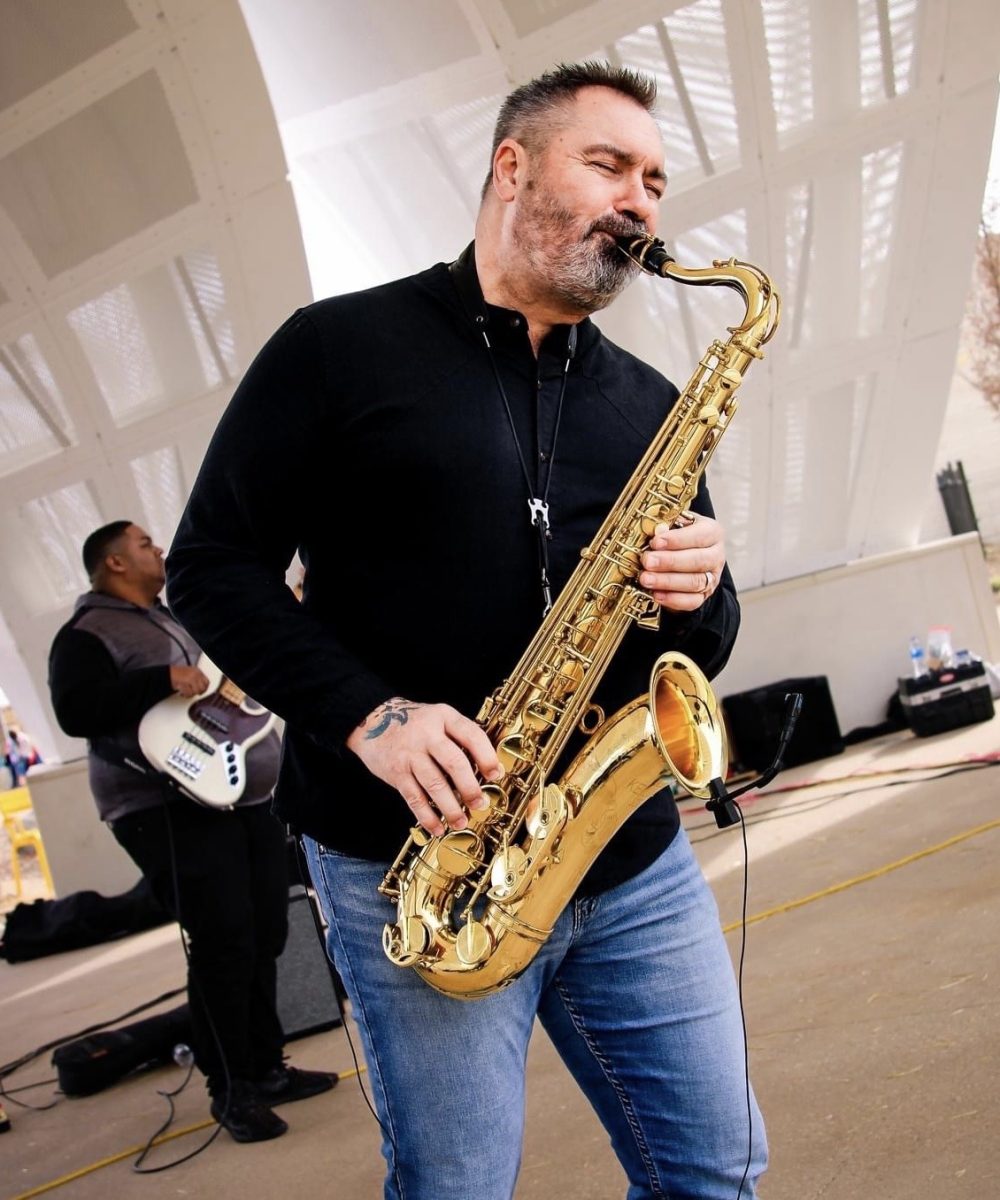 Chad Stoner playing saxophone at the Gene Leahy Mall Pavilion
 
(Image Courtesy of Chad Stoner)