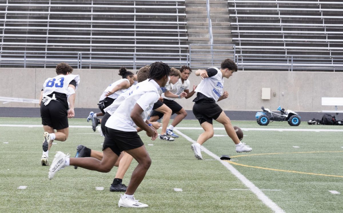 Junior Grant Beckenhauer kicks off at the Aug. 23 Sports Drink Scrimmage. 