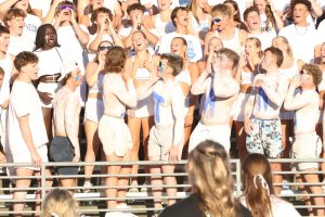 Seniors in the student section cheer during the Titan-Monarch game