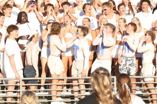 Seniors in the student section cheer during the Titan-Monarch game