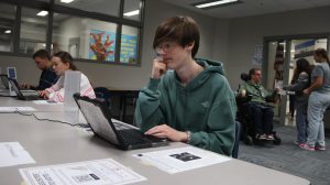 Students cast their votes in a mock election to practice the electoral process. Among the candidates on the ballot were Pollie Tician and Carlos Hernandez, fictional "Perfect President" candidates created by AP Government students Meagan Petersen and Brendan Sidzyik. More than 940 ballots had been submitted in the library by mid-afternoon Tuesday.