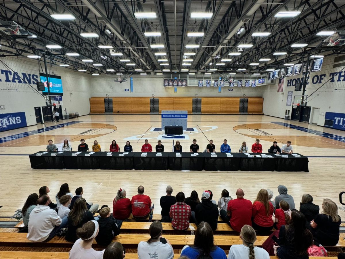 Student athletes gathered around for signing day.