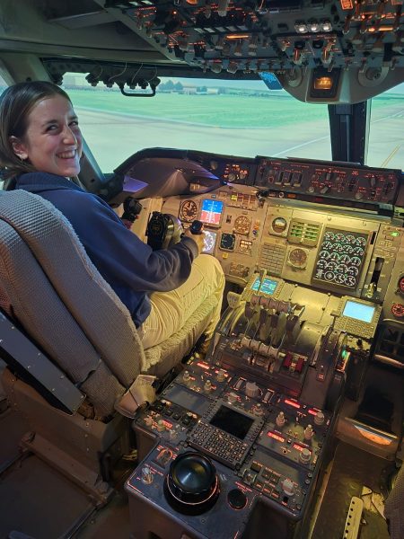 The writer in the pilot seat at the CymSTAR.