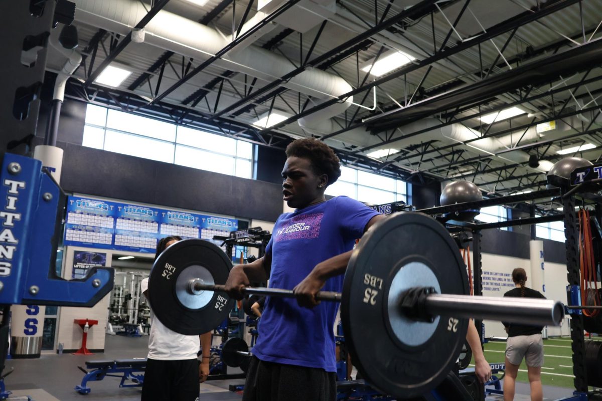 The theme for this year at Papio South is Raise The Bar. Titans raise the bar both physically and mental. Like this Titan, lifting weights to better themselves, and their team.