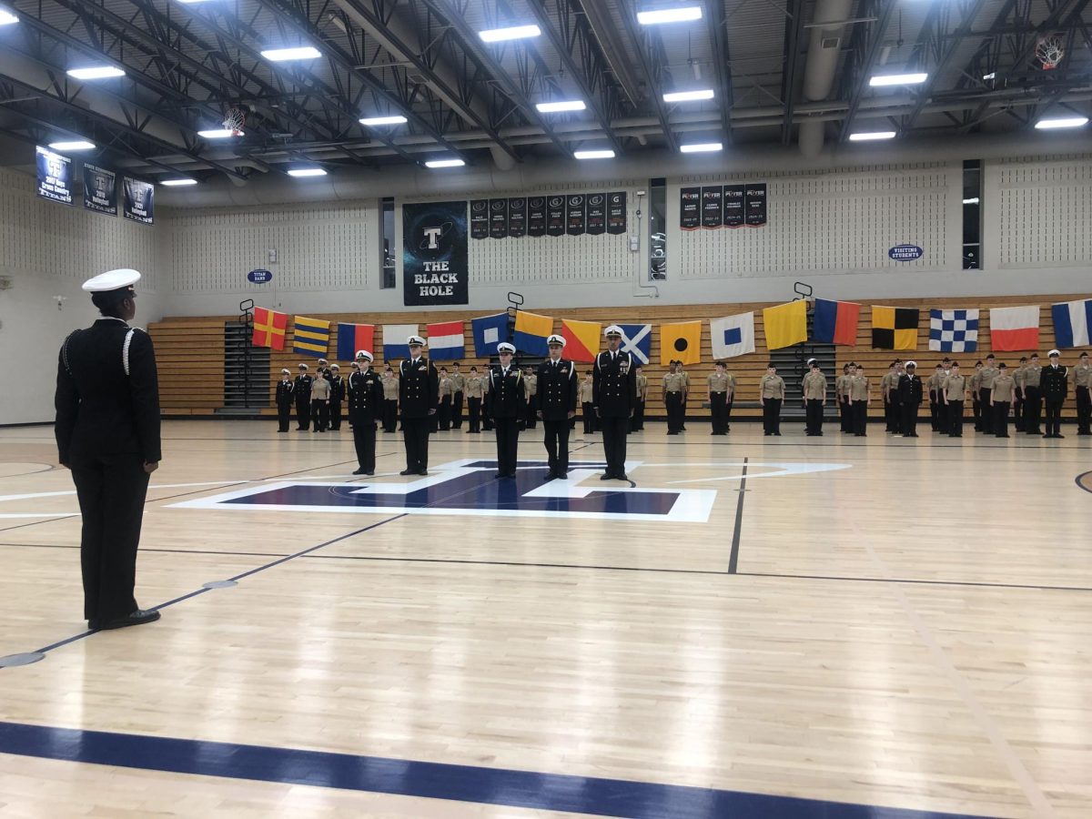 Three levels of ROTC command stand at attention