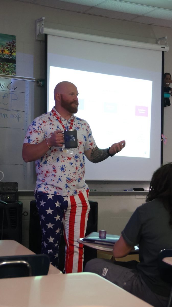 Psychology teacher Mr. Moore, dressed in red, white, and blue for the military child spirit week