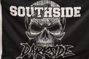 The Darkside unfurls a new flag to be flown on the field this year.