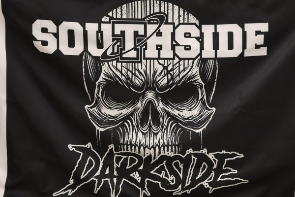 The Darkside unfurls a new flag to be flown on the field this year.