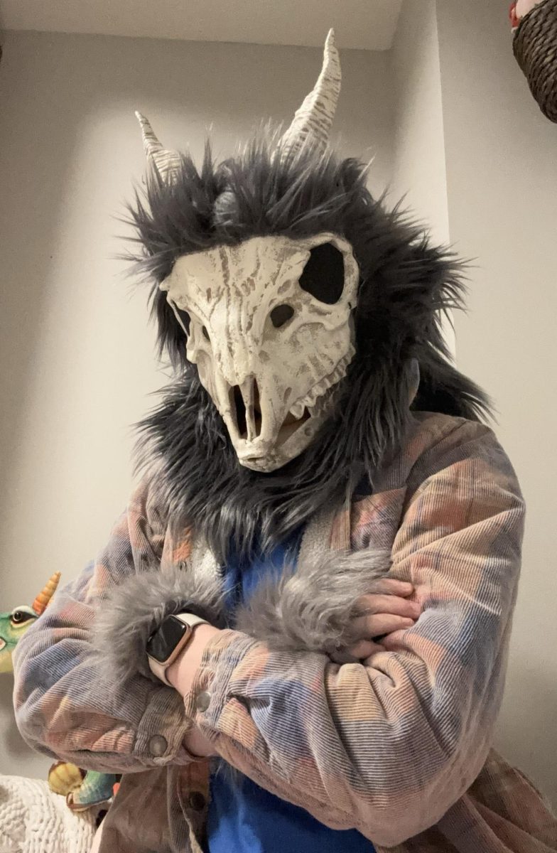 Margot Dietrich poses with a mask she created for last years Halloween, a character she named “Reaper.”
