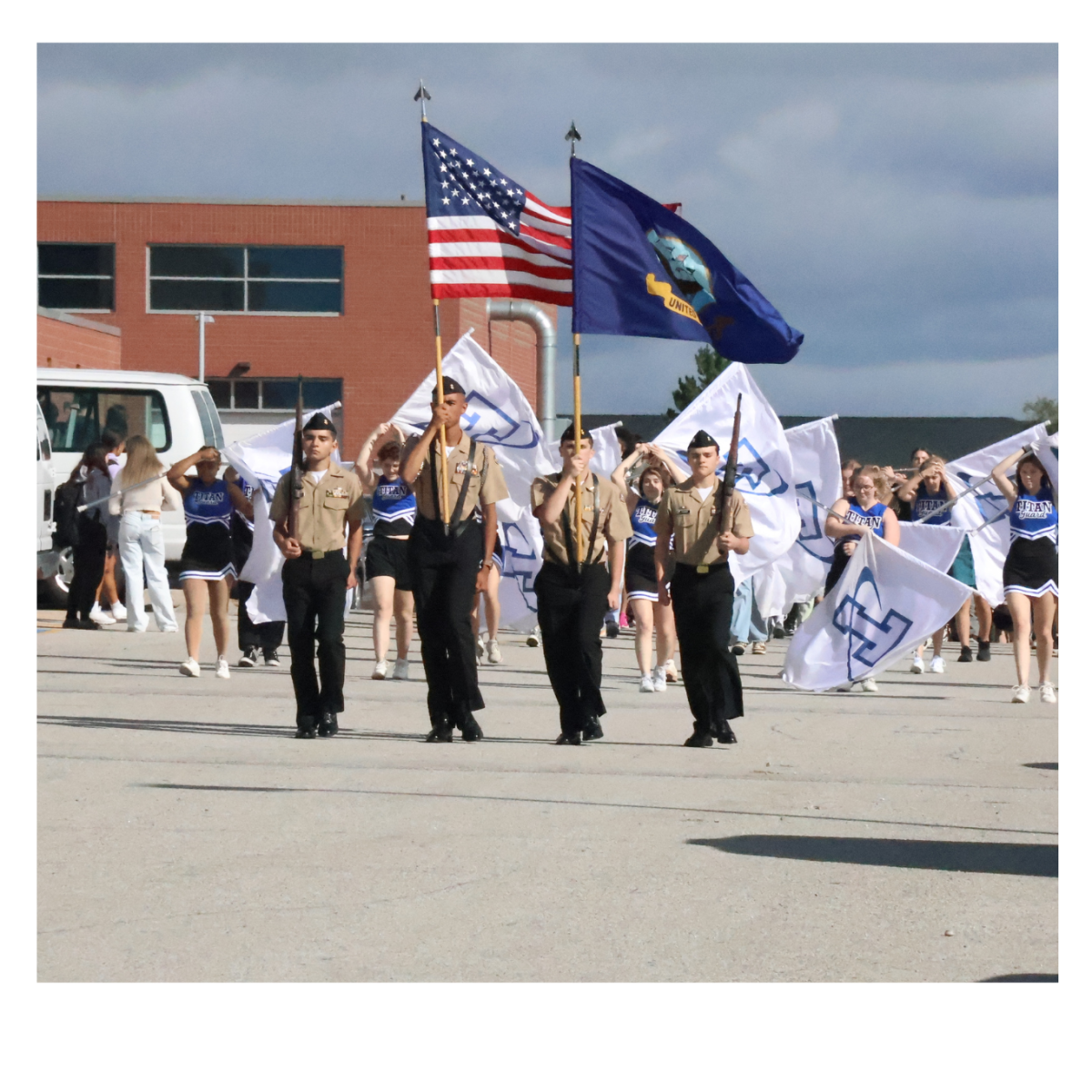 Cadets Joel Akin-Otiko, DJ Adams and Titus Pummer displaying the colors as they lead the Homecoming Parade.  
