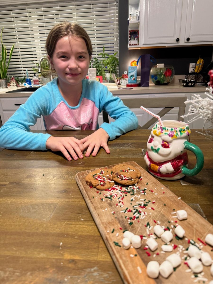 My sister proudly presents her chocolate chip cookies for Santa on Christmas Eve.