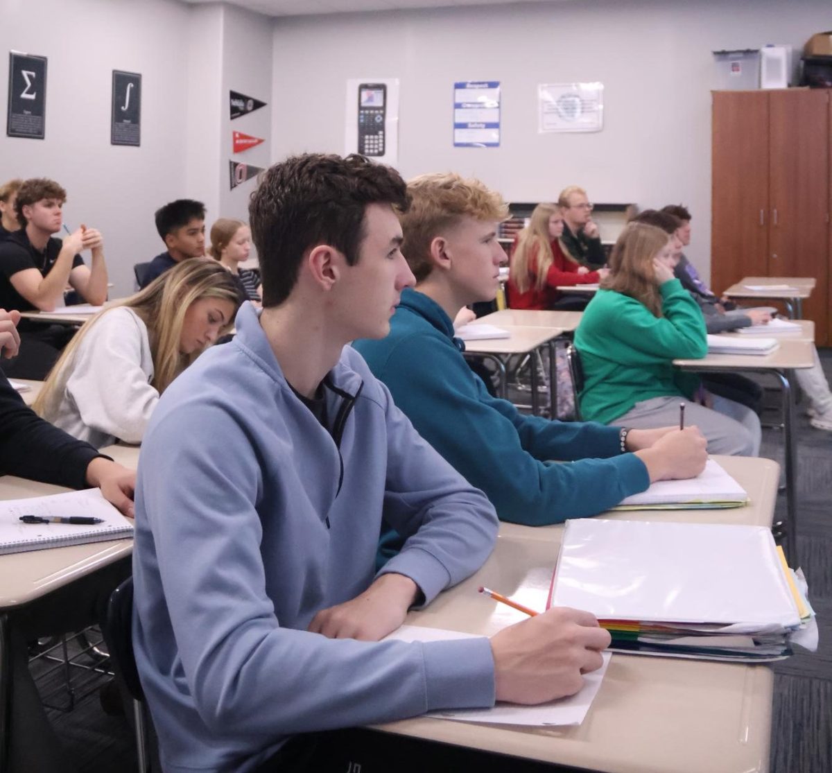Charles Hook is dialed in during AP Calculus AB, taking notes.