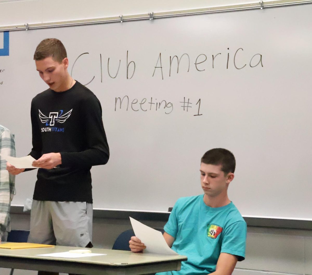 Club President Paul Connot and Vice President Jackson Tapper, both 11th, outline club values for prospective members at the first meeting of Club America on Nov. 5. 