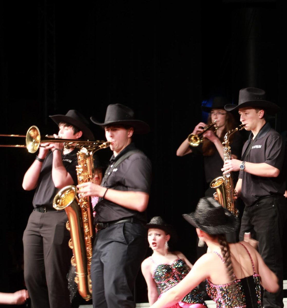 Tyler Holter, Jackson Baker, Logan Greer, and Andrew Wilson perform “Daddy Lessons.” 