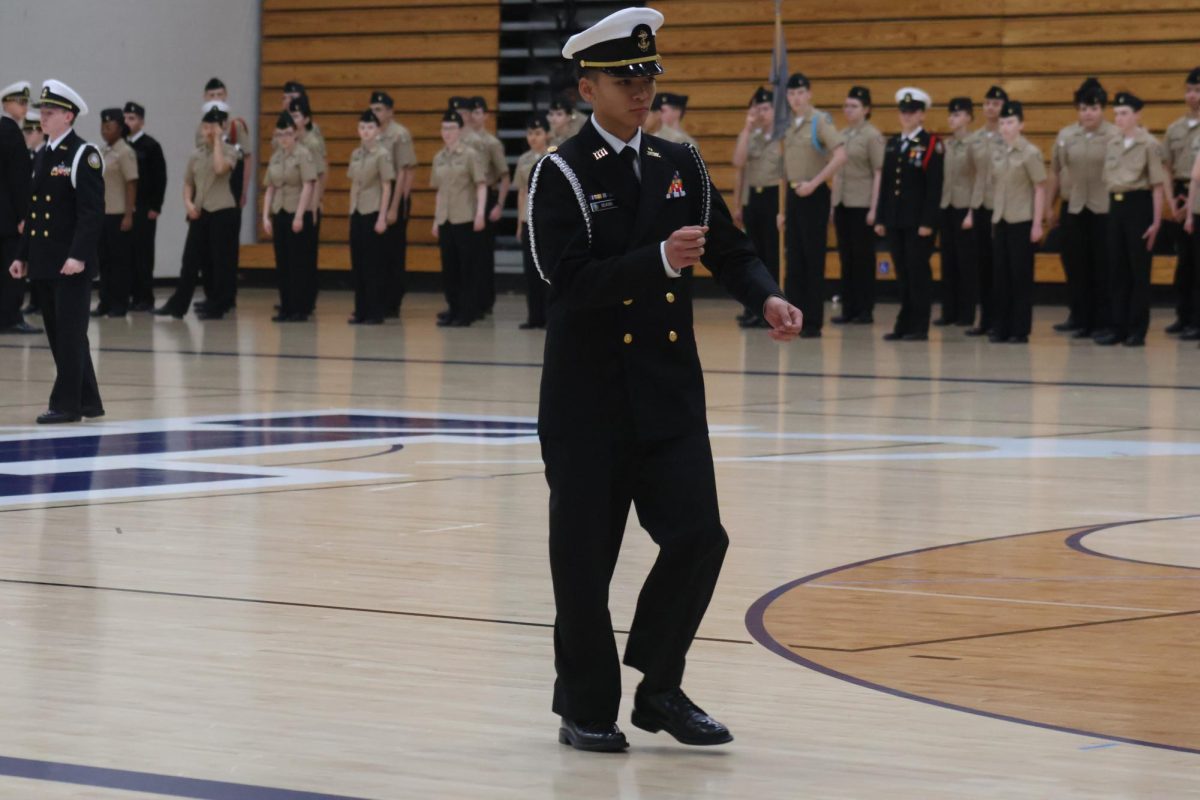 Senior Arturo DeAsis oversees the Annual Military Inspection on Feb. 11. 