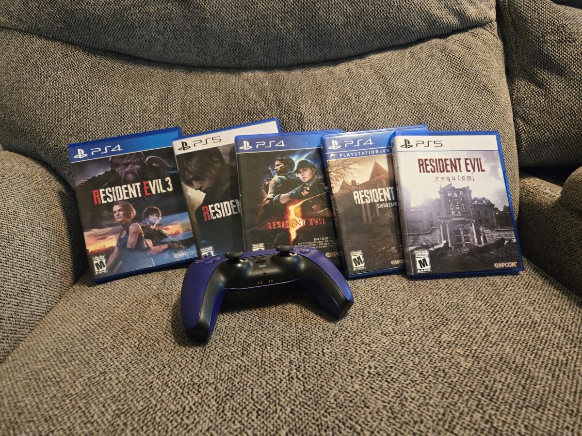 Personal copies of various Resident Evil games, including Resident Evil 3: Remake, Resident Evil 4: Remake, Resident Evil 5, Resident Evil 7: Biohazard, and Resident Evil 9: Requiem. They're positioned on the couch, with a PS5 remote in front of them.