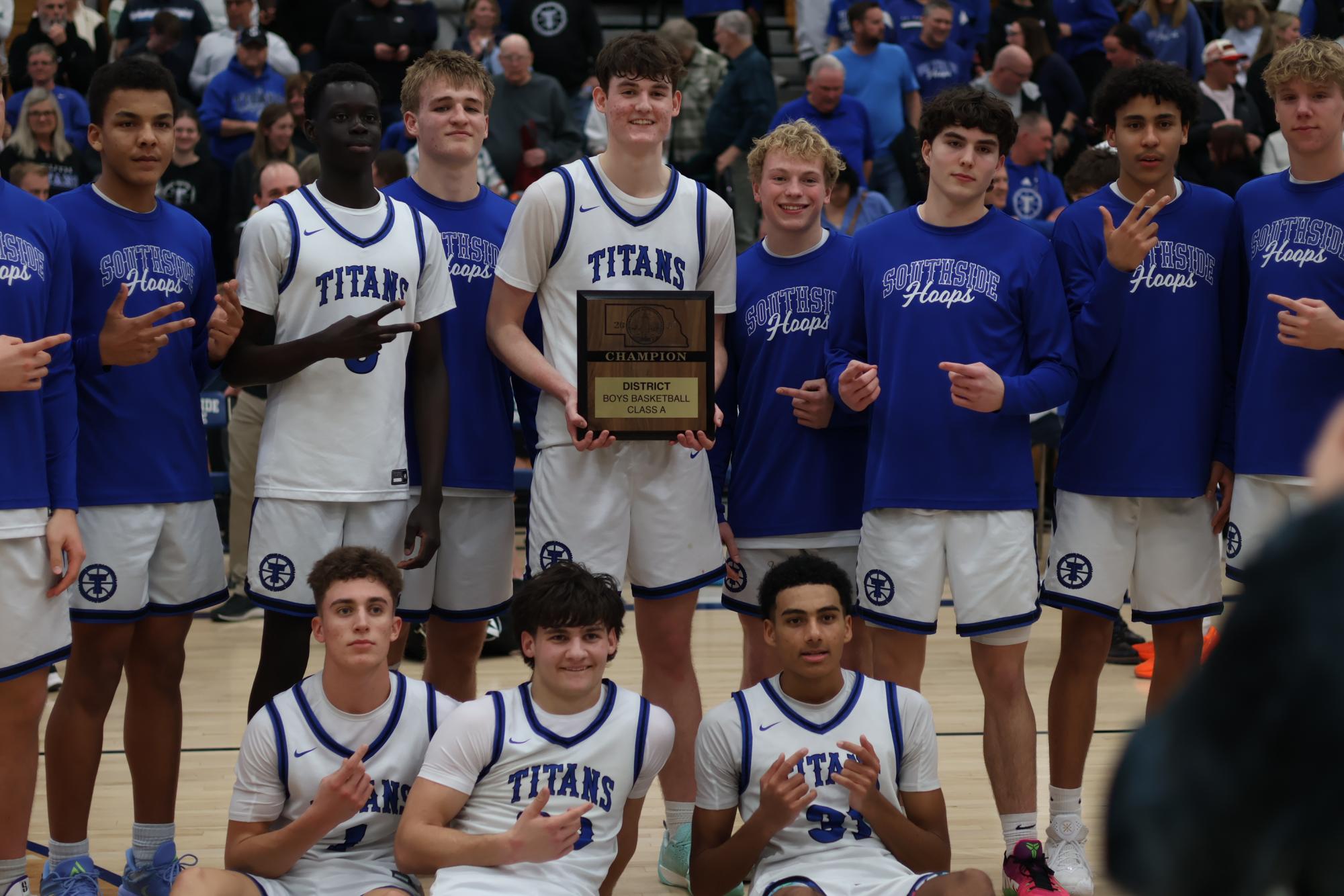 Team gathered around to pose with District A-7 trophy.