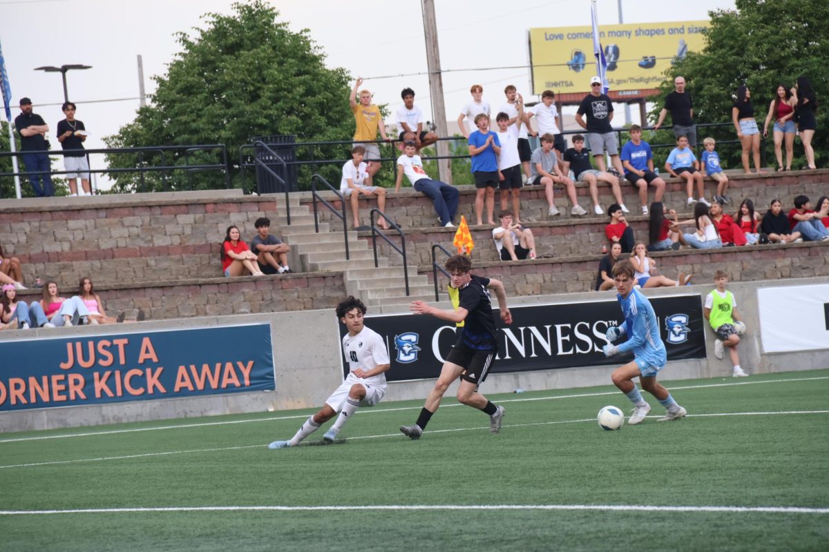 Landon Donley dribbles the ball during the semifinal matchup against Lincoln Southwest at Creighton's Morrison Stadium on May 15.