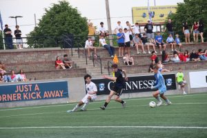 Landon Donley dribbles the ball during the semifinal matchup against Lincoln Southwest at Creighton's Morrison Stadium on May 15.