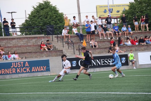Landon Donley dribbles the ball during the semifinal matchup against Lincoln Southwest at Creighton's Morrison Stadium on May 15.